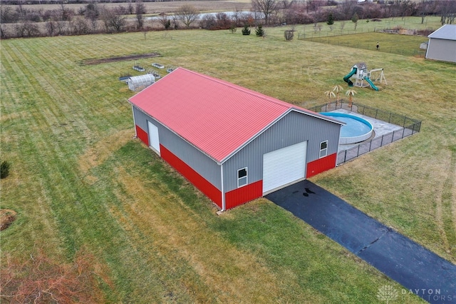 birds eye view of property with a rural view