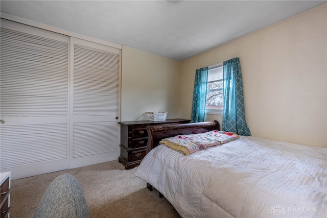 carpeted bedroom featuring a closet