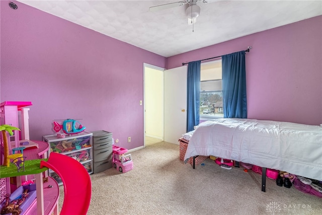 carpeted bedroom featuring ceiling fan