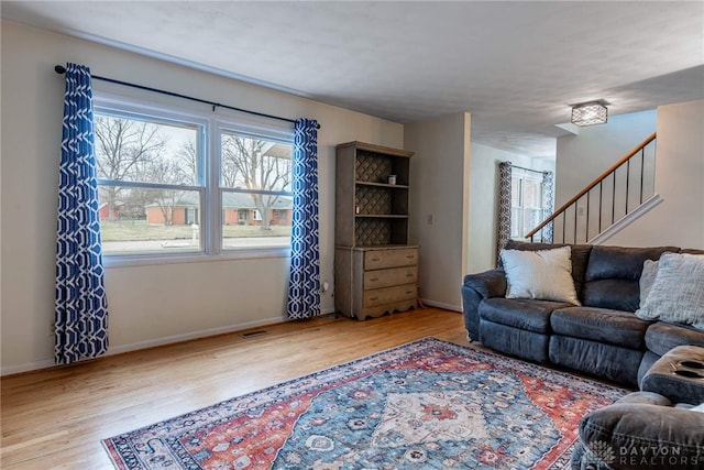 living room with light hardwood / wood-style floors