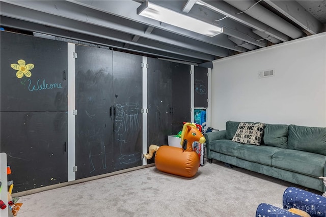 basement featuring carpet flooring