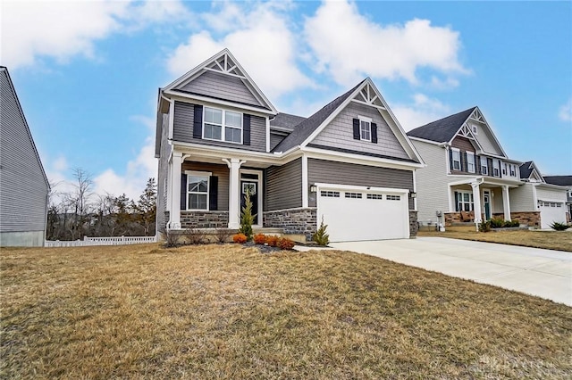 craftsman-style house with a garage, a porch, and a front lawn