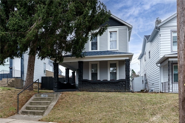 view of front of house with covered porch and a front yard