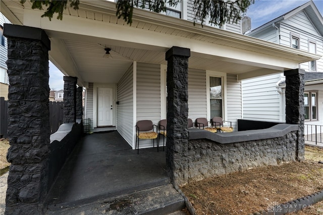 view of exterior entry with covered porch