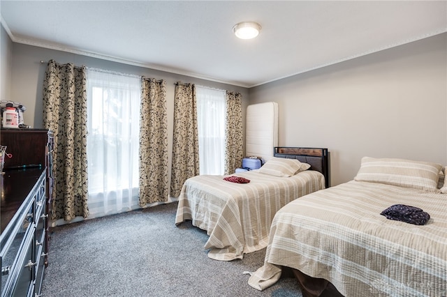 carpeted bedroom with ornamental molding