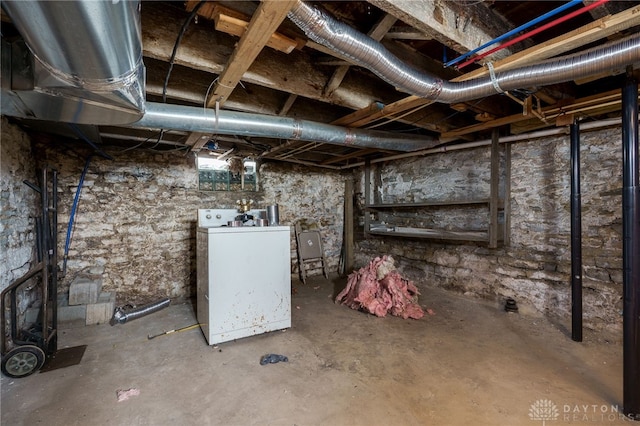 unfinished basement with washer / dryer