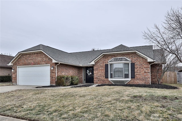 ranch-style house with a garage and a front lawn