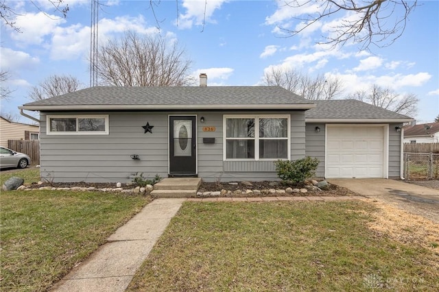 ranch-style home with a garage and a front lawn