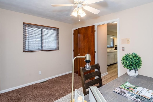 home office featuring ceiling fan and carpet flooring