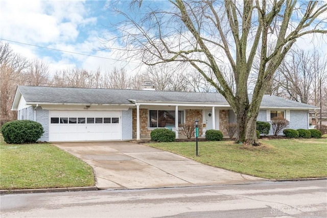 ranch-style home featuring a garage and a front yard