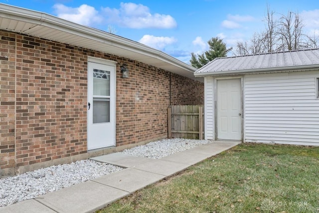 entrance to property with a yard