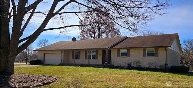 ranch-style house with a garage and a front yard