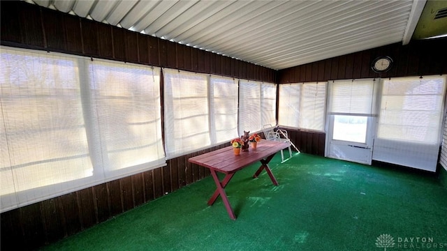 unfurnished sunroom with vaulted ceiling