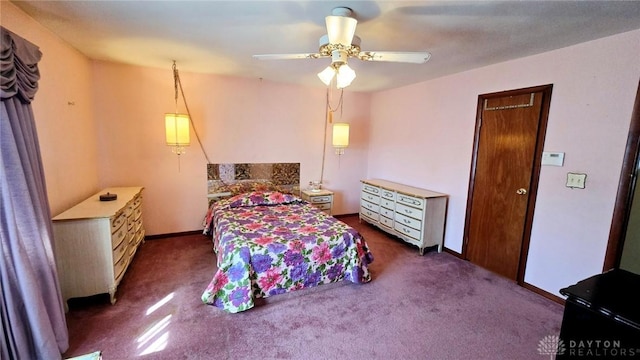 bedroom with dark colored carpet and ceiling fan