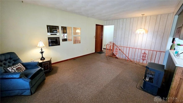 sitting room featuring dark carpet