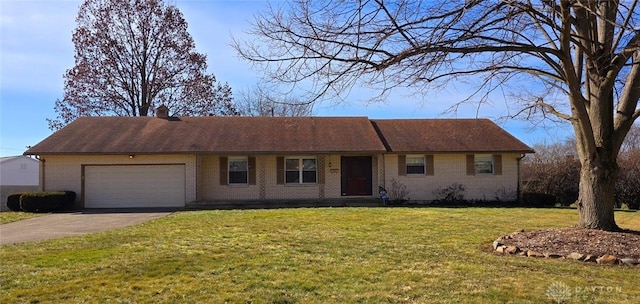 ranch-style home with a garage and a front lawn