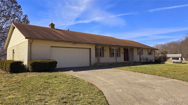 ranch-style home with a garage and a front lawn