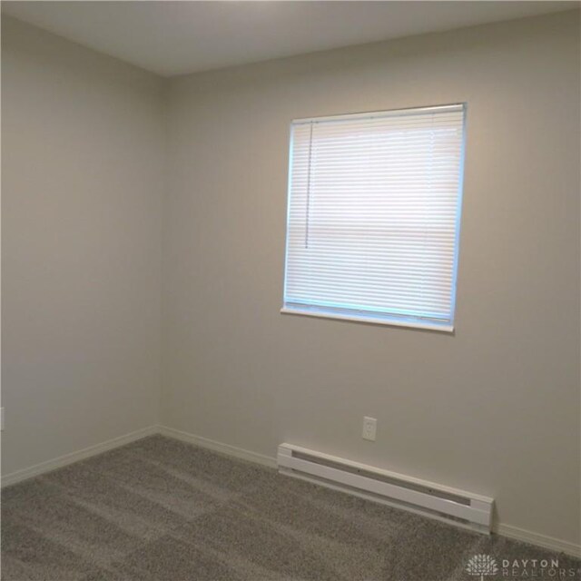 1148 Hamilton, Sidney, OH 45365 - carpeted spare room with baseboard heating