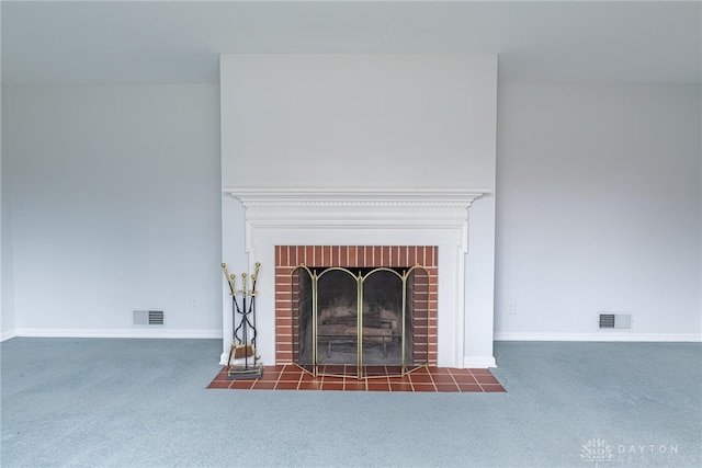 interior details with a fireplace and carpet