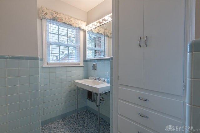 bathroom with tile walls