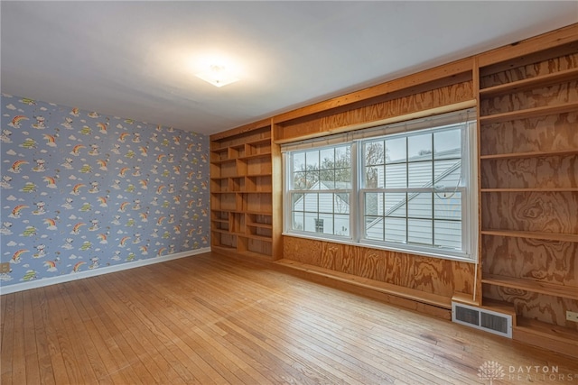 empty room with light hardwood / wood-style floors