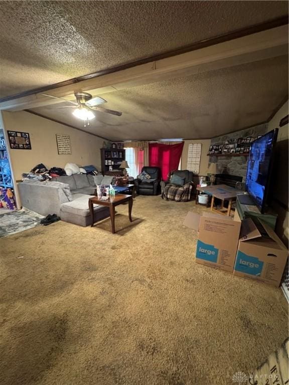 living room with ceiling fan, carpet flooring, a fireplace, and a textured ceiling