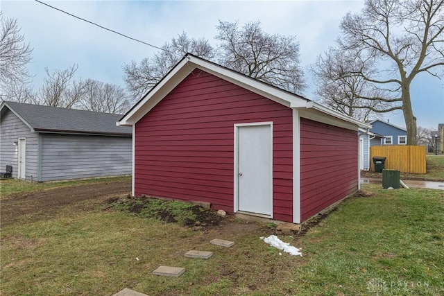 view of outbuilding featuring a yard