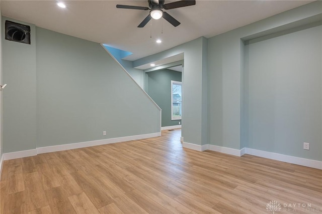 empty room with ceiling fan and light wood-type flooring