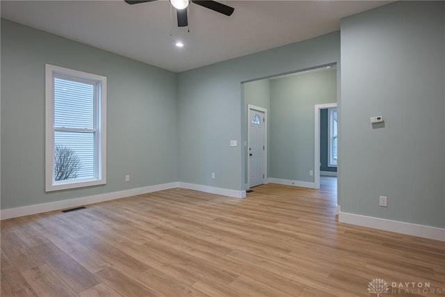 unfurnished room with light hardwood / wood-style flooring and ceiling fan