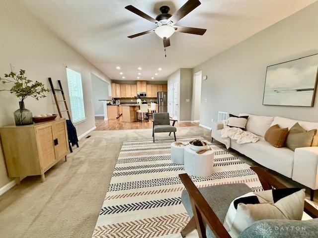 living room with ceiling fan