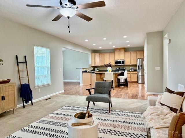 living room with ceiling fan