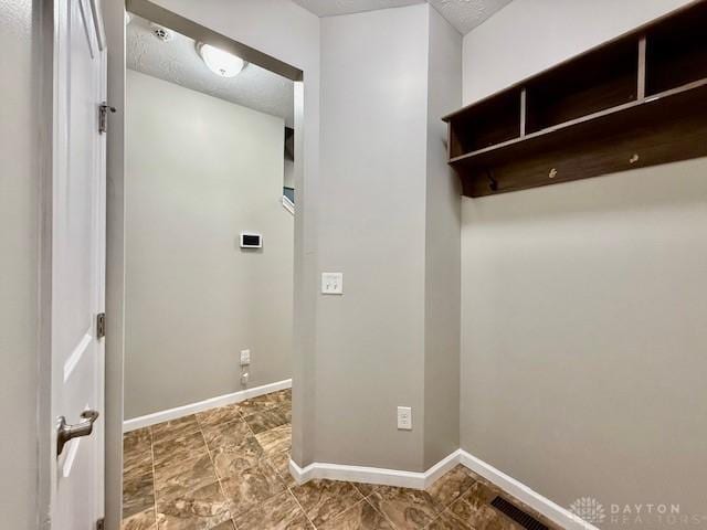 washroom featuring a textured ceiling