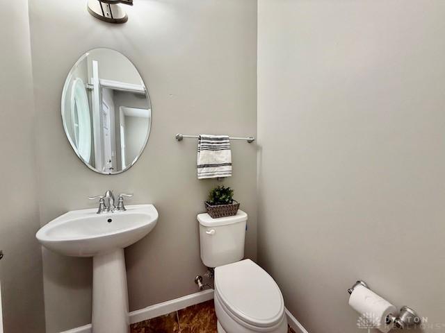 bathroom featuring sink and toilet