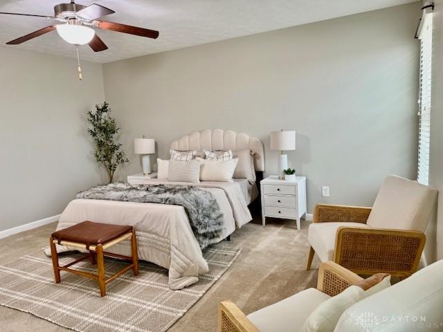 bedroom featuring carpet floors and ceiling fan