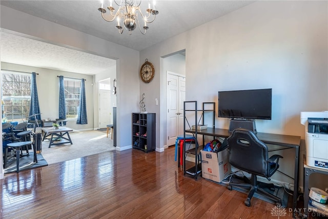 home office with baseboards, a chandelier, dark wood finished floors, and a textured ceiling