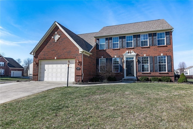 colonial inspired home featuring driveway, brick siding, a front lawn, and an attached garage