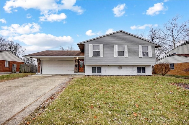 split level home featuring a garage, driveway, and a front lawn