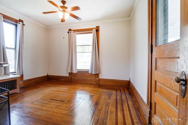 201 E Somers St, Eaton, OH 45320 - spare room featuring ceiling fan, baseboards, and ornamental molding