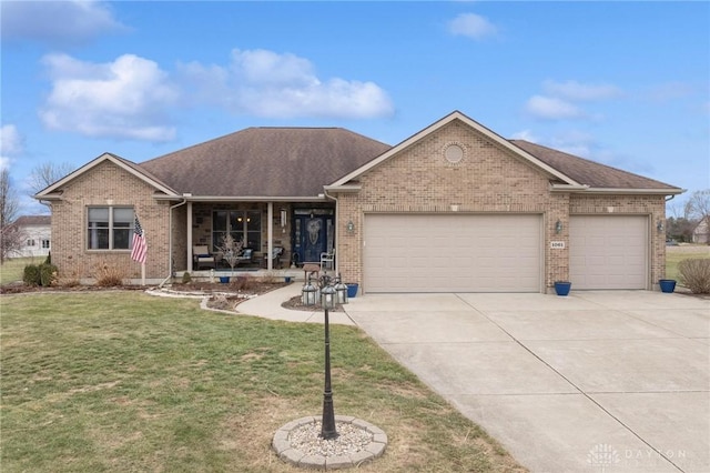 view of front of home featuring a garage and a front lawn