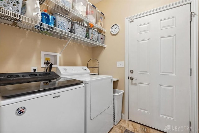 clothes washing area with separate washer and dryer