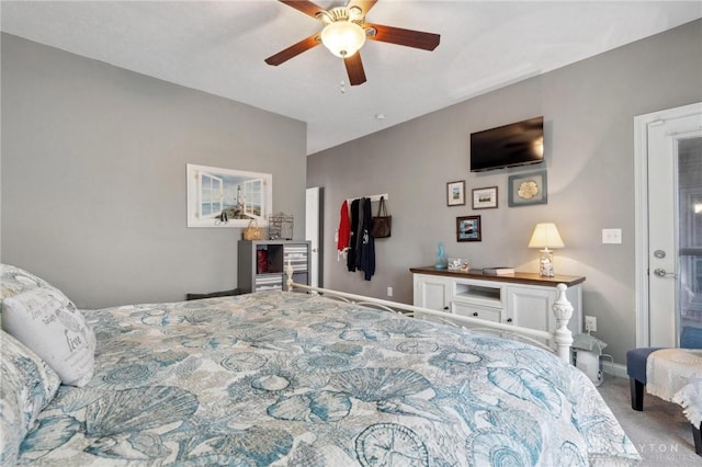 bedroom featuring ceiling fan and carpet