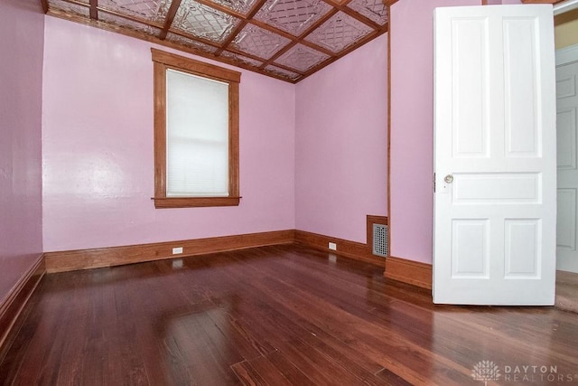 spare room featuring hardwood / wood-style floors