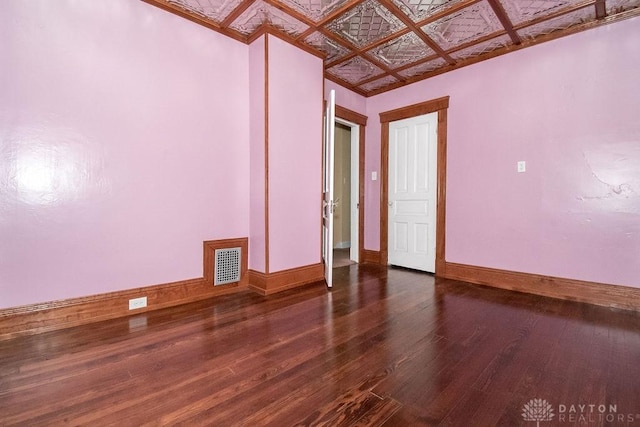 unfurnished room featuring dark wood-type flooring