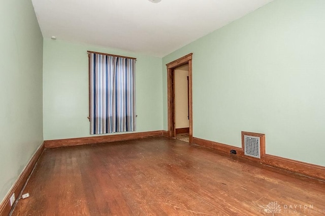 spare room with hardwood / wood-style floors