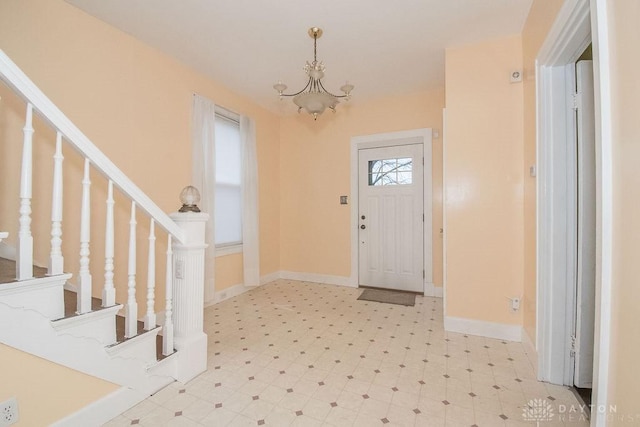 foyer with a chandelier