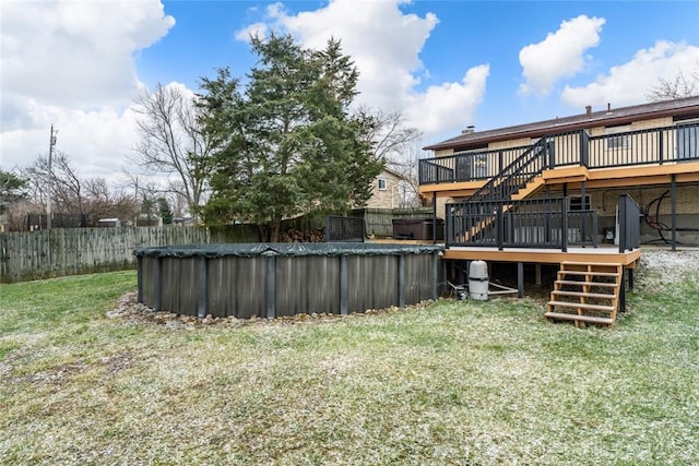 view of yard with a pool side deck