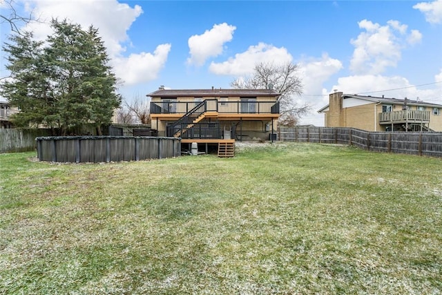 exterior space with a pool side deck and a lawn