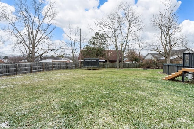 view of yard featuring a trampoline