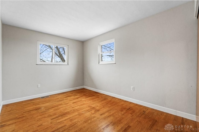 unfurnished room featuring light wood-type flooring