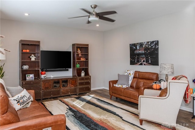 living room with hardwood / wood-style flooring and ceiling fan